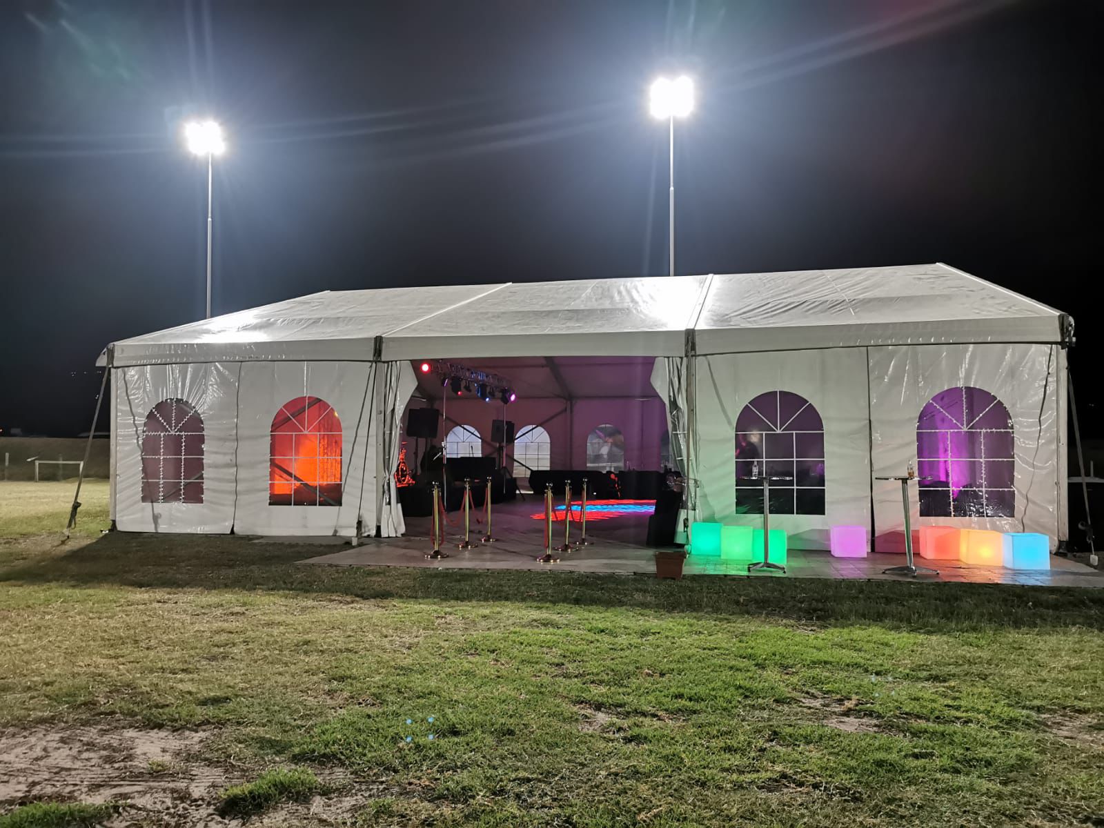 Marquee tent night event with coloured lighting and dance floor — party hire Gauteng